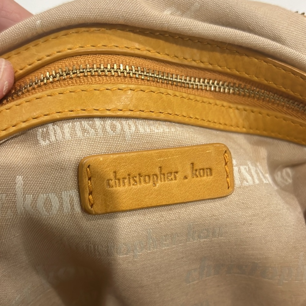 Handbag by Christopher Kon, Butterscotch leather. 15.5” w, 14.25” l, 1” d, - Picture 8 of 11